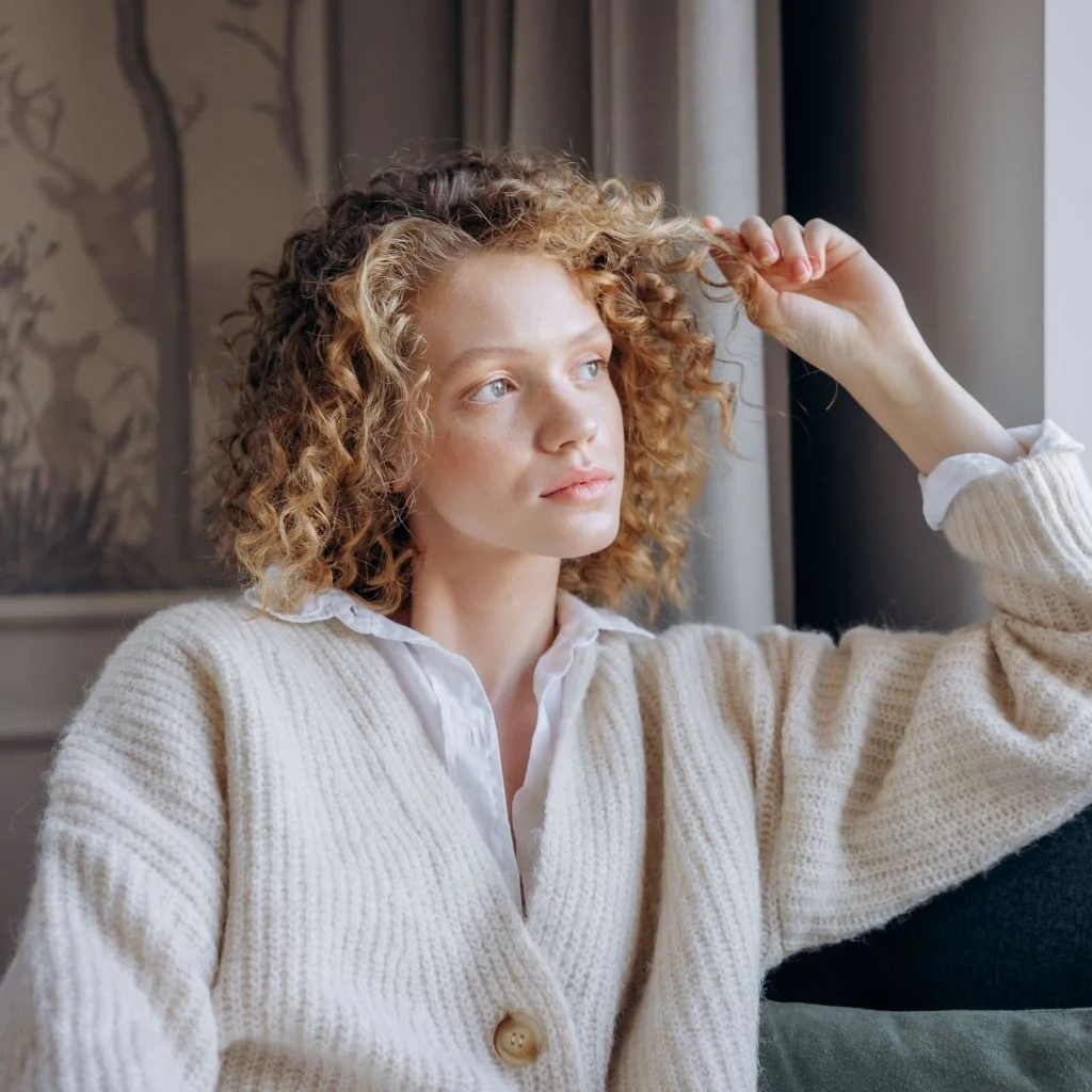 Curly Curtain Bangs Blend Naturally Into Layered Texture
