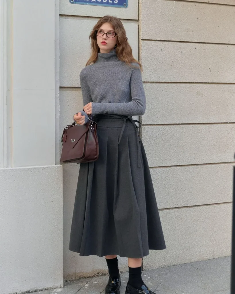 Fitted grey waisted cardigan with pleated midi skirt and ankle boots