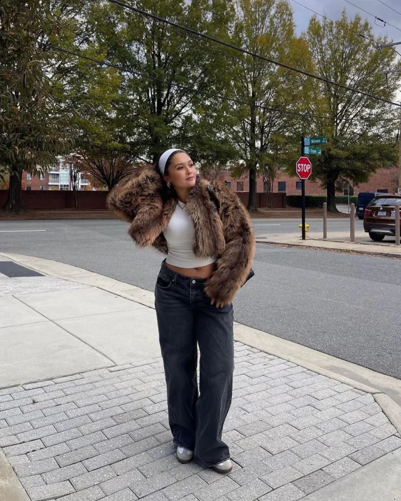 cropped faux fur jacket baggy jeans woman