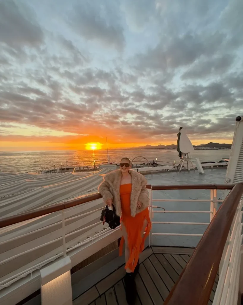 sunset cruise deck woman